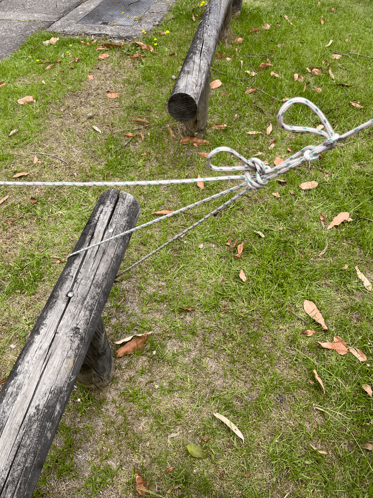 Marquee tied to a pole with rope